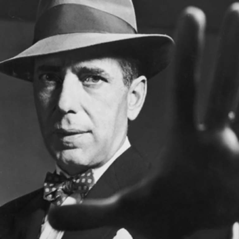 man with hat reaching hand out